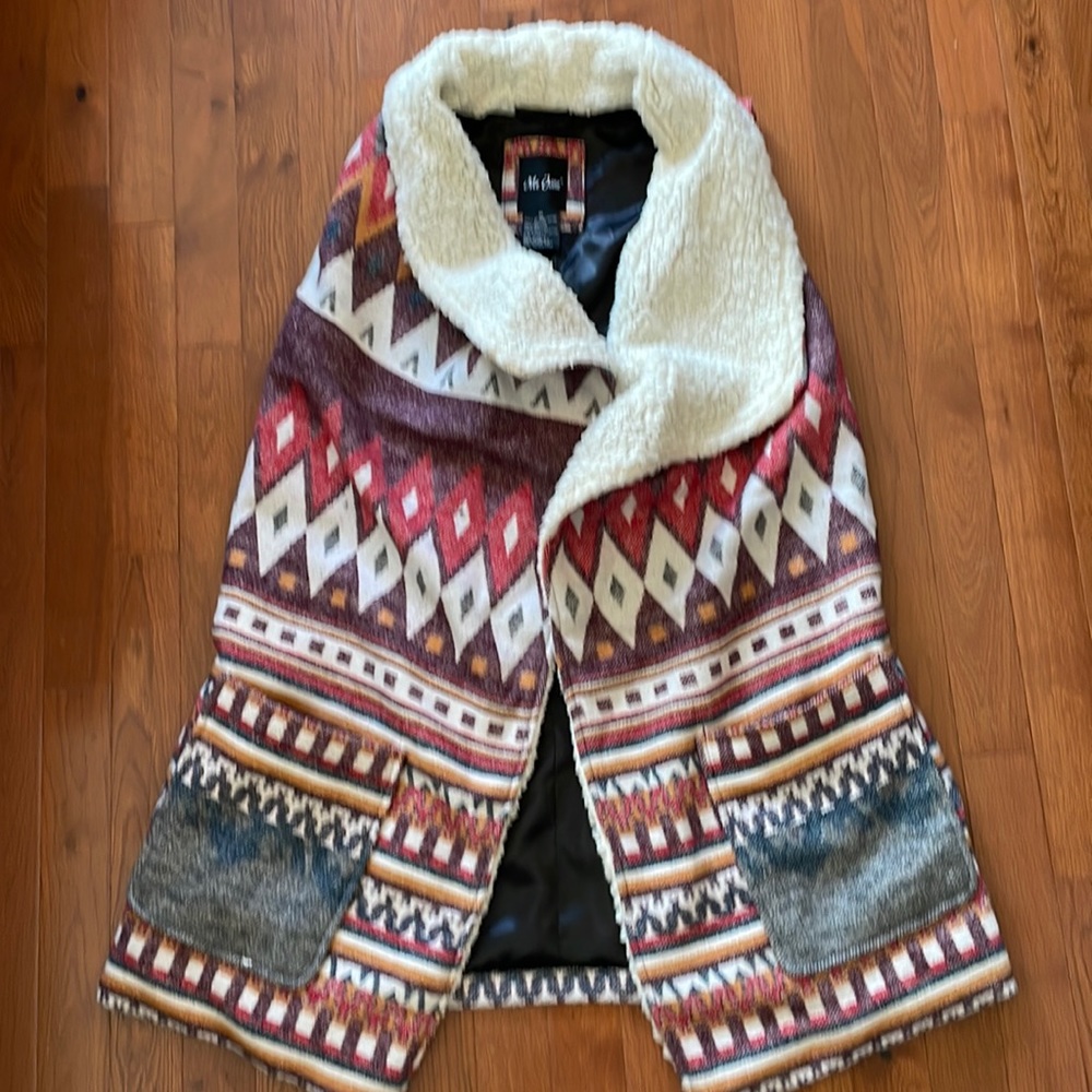 Sleeveless long coat